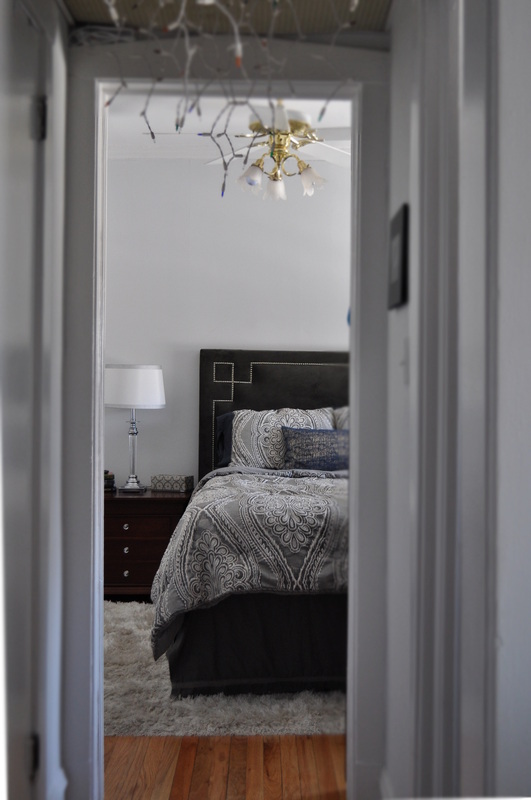 Bedroom, reversible comforter, nail head headboard, grey, white rug