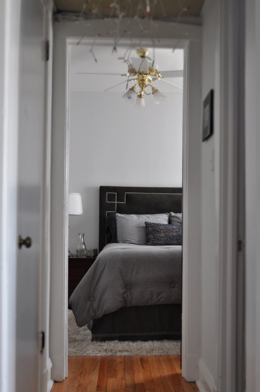 Bedroom, reversible comforter, nail head headboard, grey, white rug